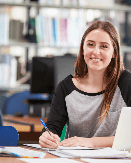Happy student in a library